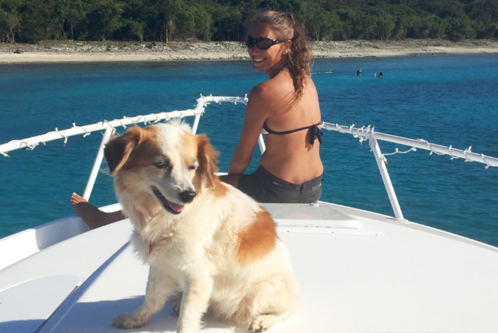 Girl with dog on boat